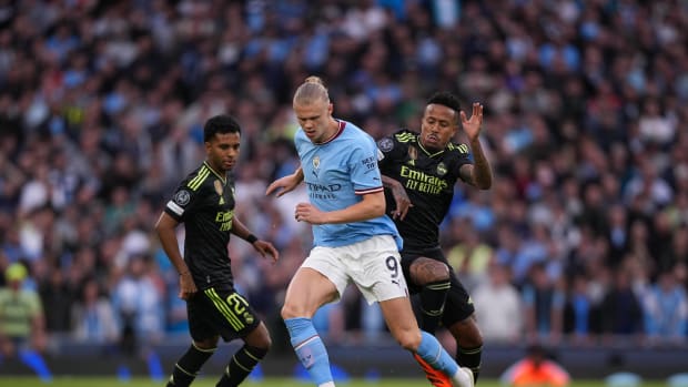 Erling Haaland pictured (center) playing for Manchester City against Real Madrid in the semi-finals of the UEFA Champions League in May 2023